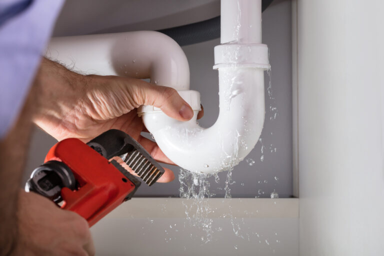 bathroom sink leaking from top